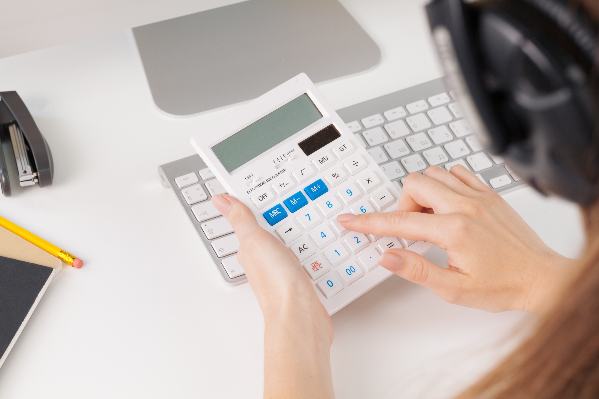 woman hands working with calculator close up